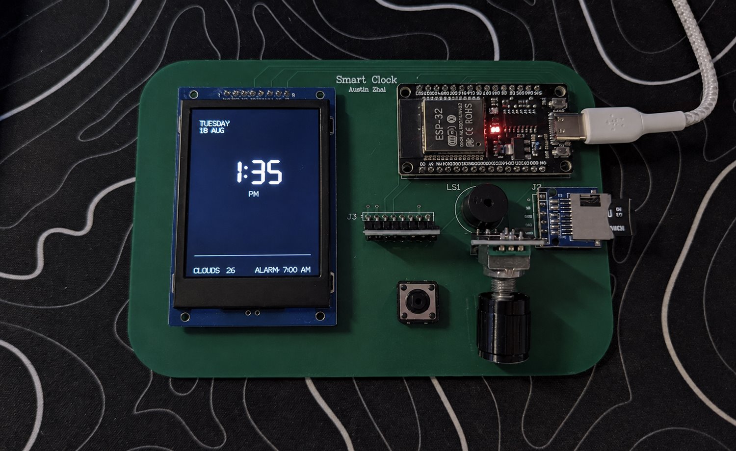 Finished Smart Alarm PCB showing time, date, weather and alarm status